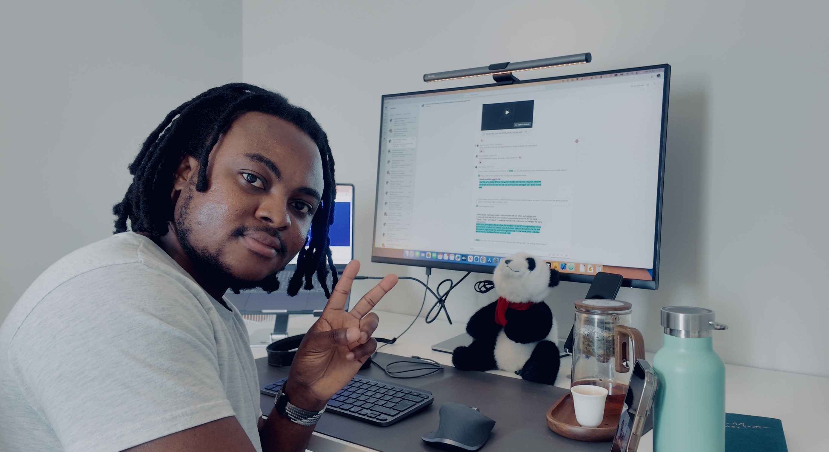 Kenn working at his desk with dual monitors showing code and accessibility tools